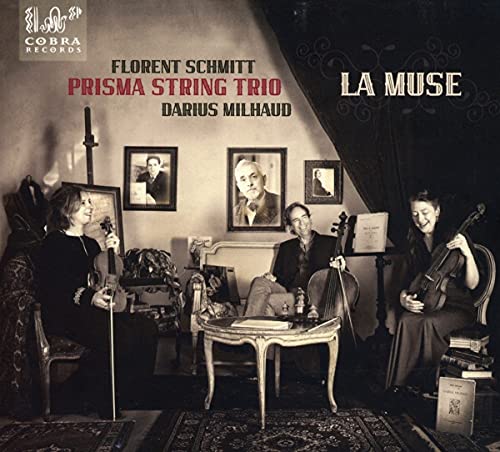 "CD cover featuring three musicians playing string instruments in a dimly lit room."