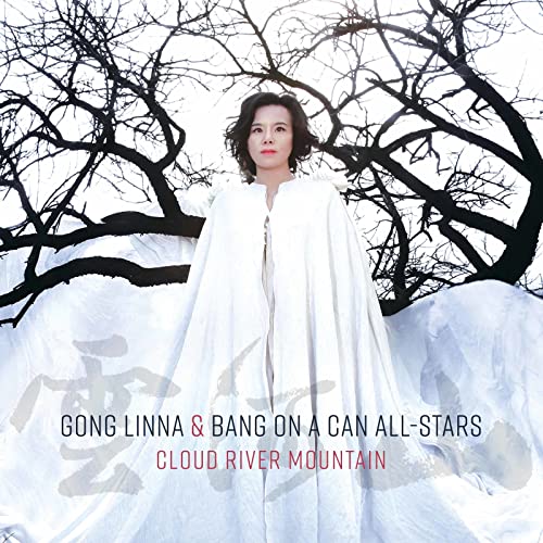 CD cover featuring a woman in white standing before bare trees.