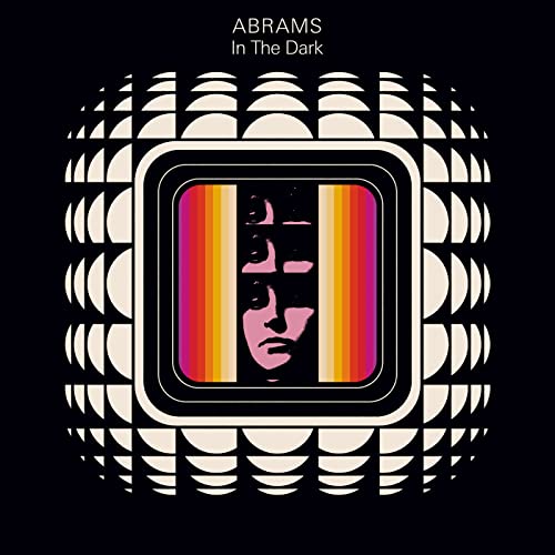 “Abrams - In The Dark” CD cover with a face in a geometric pattern.