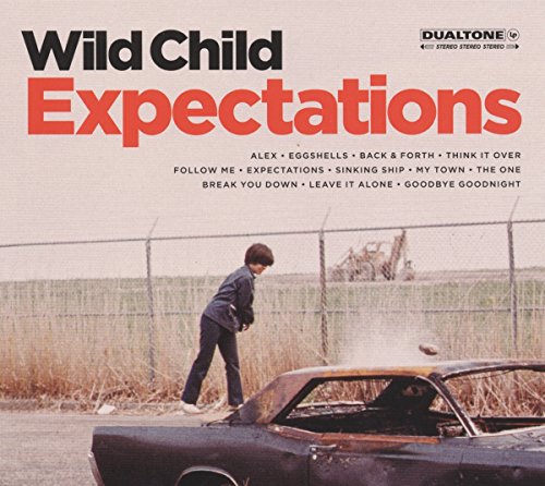 "Album cover with a boy standing beside a damaged car near a fence."