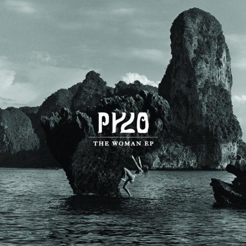 Pylo’s “The Woman EP” CD cover: landscape with rock formations and a figure.