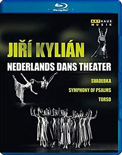 "Dance performance cover with dancers in white, black background, and yellow and white text."