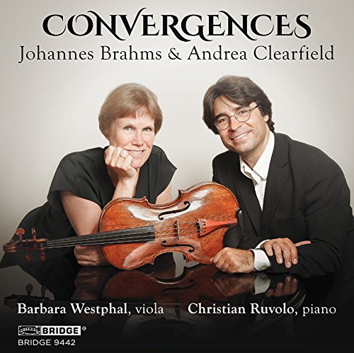 "CD cover featuring a man and woman with a viola on a table."