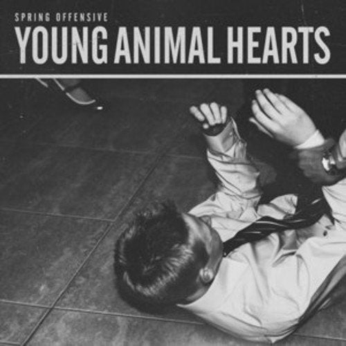 Black and white vinyl album cover with a man lying on the floor.