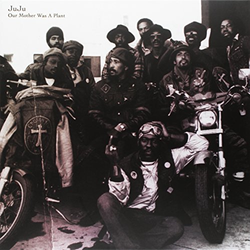 Black and white group portrait with motorcycles, album cover for Juju.