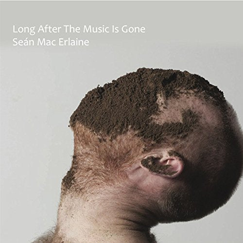 Vinyl album cover with a man's head covered in dirt against a gray background.