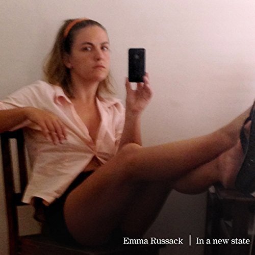 A woman sits on a chair, holding a phone, with text overlay at the bottom.