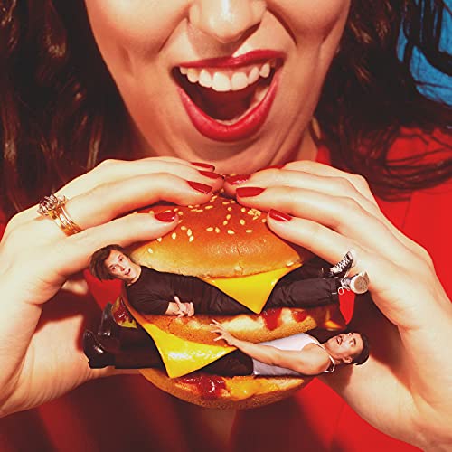 CD cover: Woman with open mouth holding a burger with two people inside.