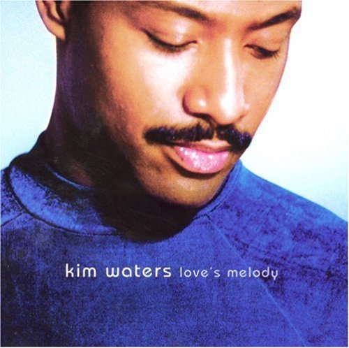 "Album cover featuring a man with closed eyes, wearing a blue sweater."