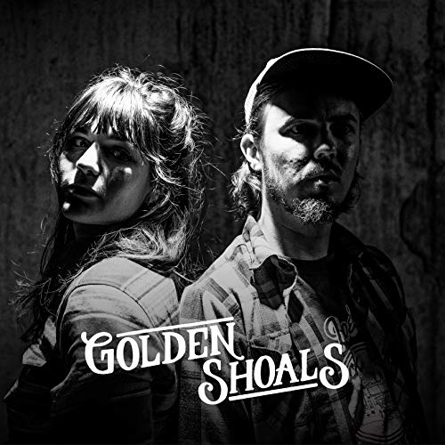 "Black and white album cover featuring a man and woman standing back-to-back."
