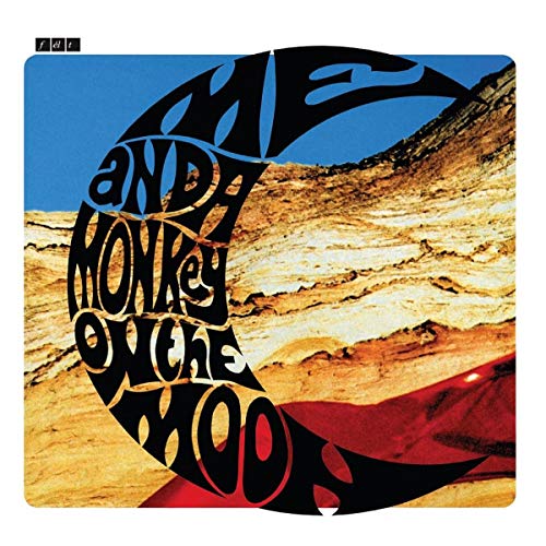 Vinyl album cover with a crescent moon and desert landscape.