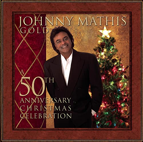 Johnny Mathis portrait with a Christmas tree, celebrating a 50th anniversary.
