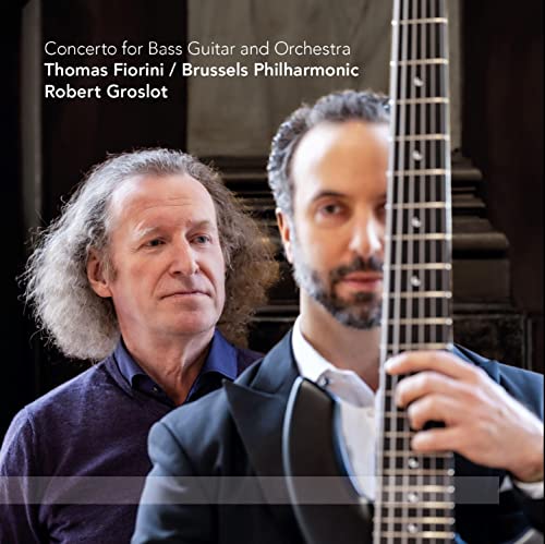 Album cover featuring two men with a bass guitar, text details composers.