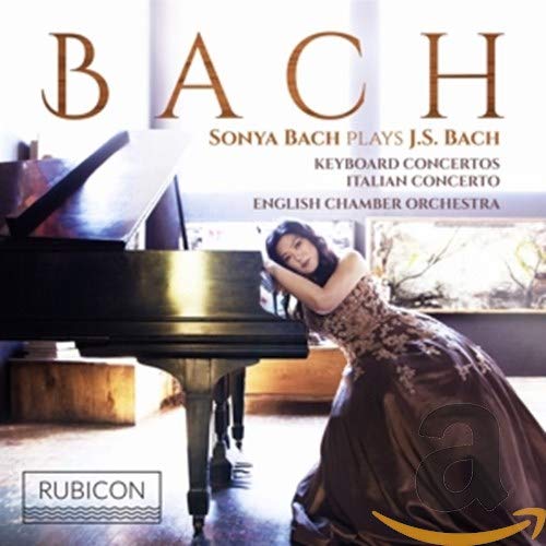 CD cover: Sonya Bach at a piano, with “BACH” in large gold letters.