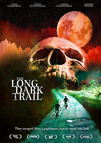 Movie poster for "The Long Dark Trail" featuring a skull and a moonlit road.