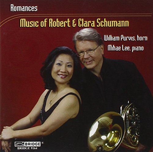 CD cover featuring a man and woman in black, man holding a French horn.