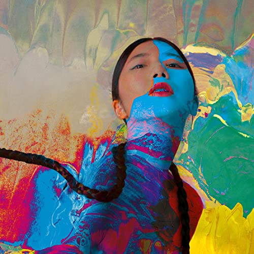 Woman with painted face amidst swirling colorful abstract paint.