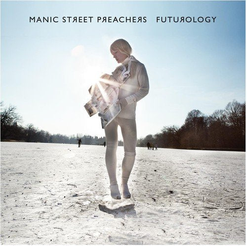 Manic Street Preachers album cover: woman in white standing on icy ground, reading newspaper.