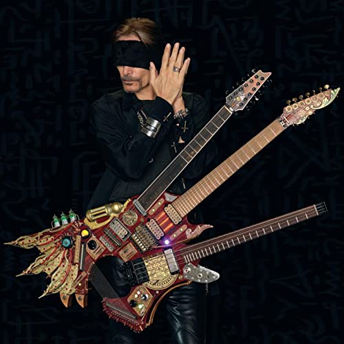 Steve Vai wearing a blindfold and holding a complex, multi-necked custom electric guitar.