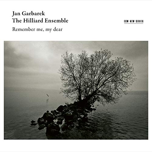 "Album cover with black and white photo of a tree on a rocky outcrop."