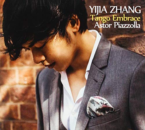 CD cover featuring a man in a suit with his head bowed.