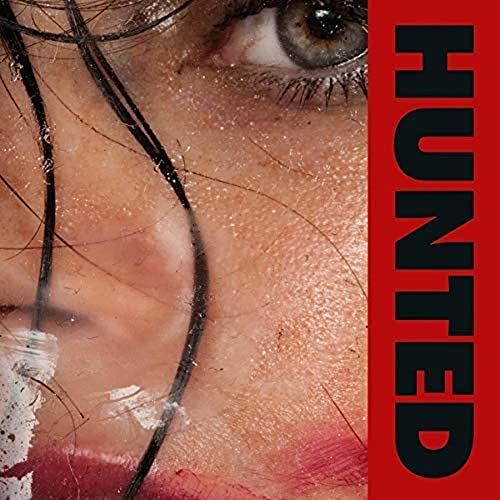 Close-up of a woman’s eye and face with red “HUNTED” text.