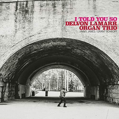 Album cover: "I Told You So" by Delvon Lamarr Organ Trio, man under arch.