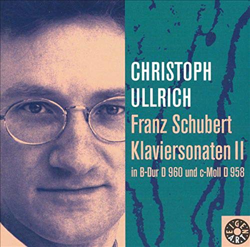 "CD cover with a man's face and text on a green background."
