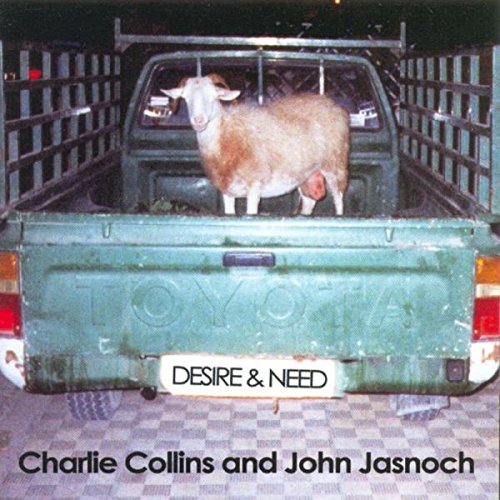 "Album cover with a goat in the back of a green Toyota pickup truck."