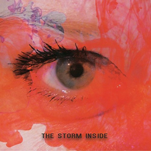A CD cover featuring a close-up of an eye behind a red sphere.