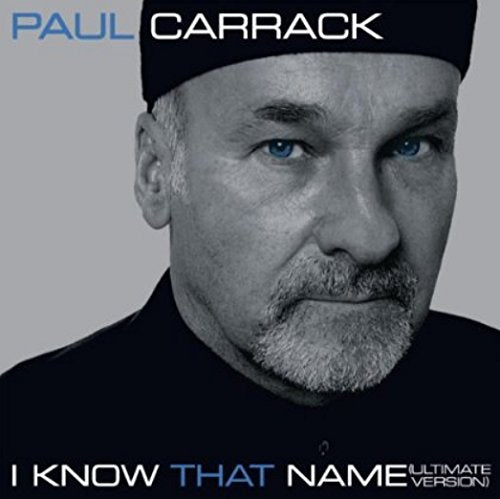 Black and white image of a man wearing a hat, with blue eyes and text overlay.
