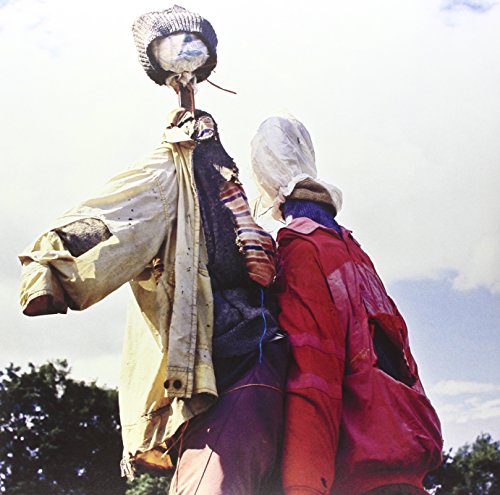 Record cover featuring two figures in patched clothing, viewed from behind.