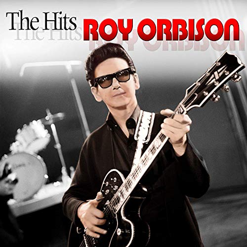 Roy Orbison with sunglasses and a guitar, album cover art.