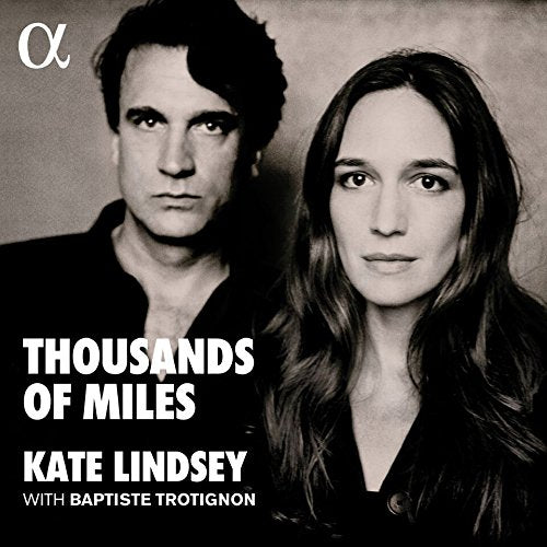 Black and white album cover featuring a man and woman looking directly at the camera.