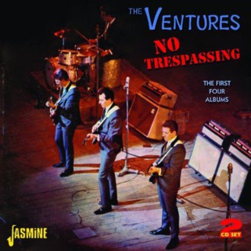 "CD cover featuring three men in suits playing guitars on a stage."