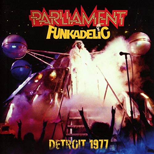 Parliament Funkadelic album cover: a stage with figures, disco balls, and smoke.