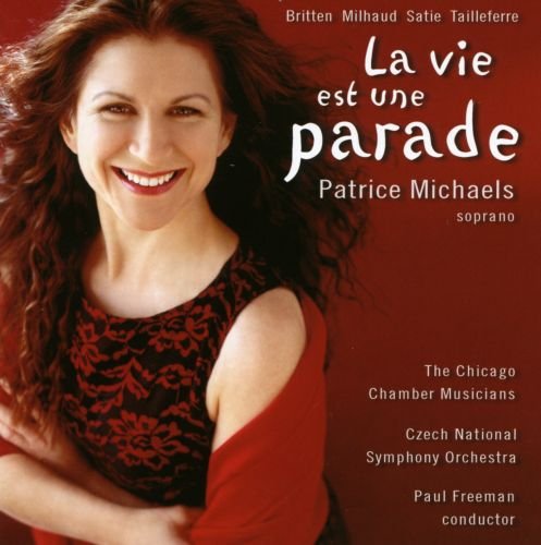 CD cover featuring a smiling woman with long brown hair against a red background.