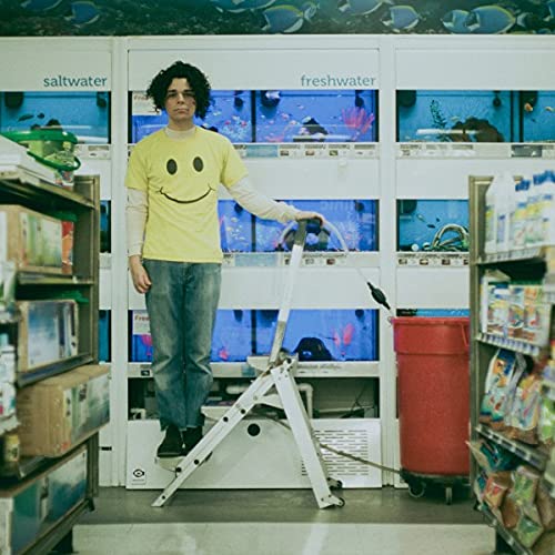 Vinyl album cover: man with fish tanks, yellow shirt, and ladder.