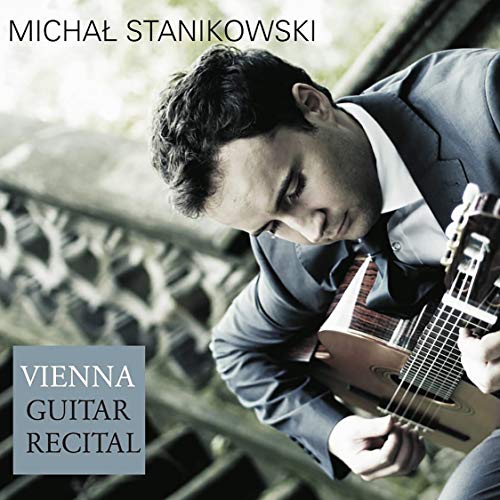 Man in a suit playing guitar on a CD cover with text "Vienna Guitar Recital".