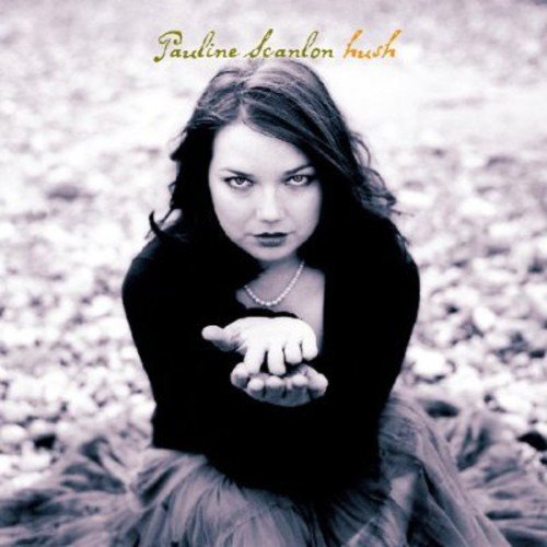 "Album cover featuring a woman sitting on the ground with outstretched hand."
