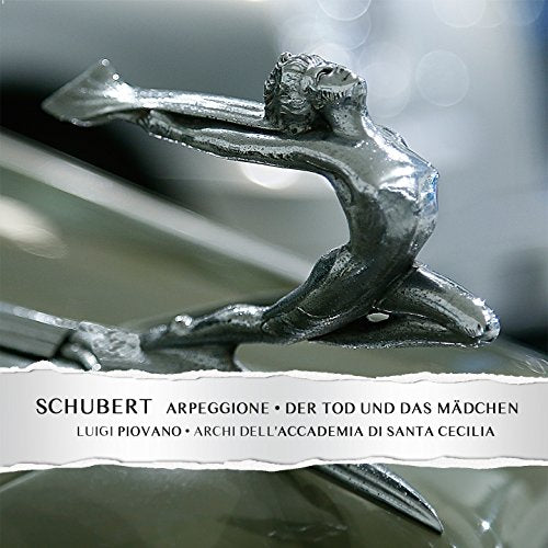 Silver sculpture of a reclining figure with "Schubert" text overlay.
