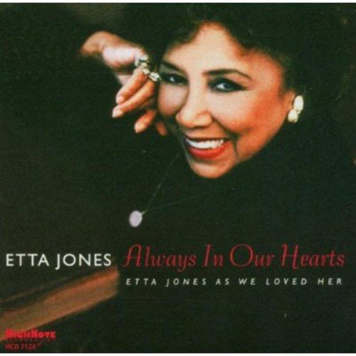 "Etta Jones album cover featuring a smiling woman with dark hair and red lipstick."