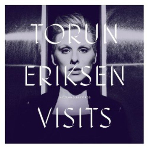 "CD cover with a woman's face behind vertical bars, text overlay."