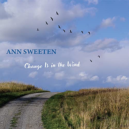 CD cover: blue sky, birds, grassy path, and album title.