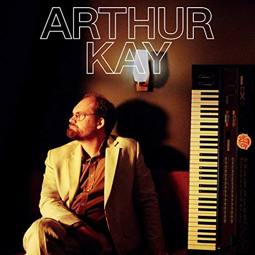 "Album cover with a man sitting beside a keyboard, 'ARTHUR KAY' written above."