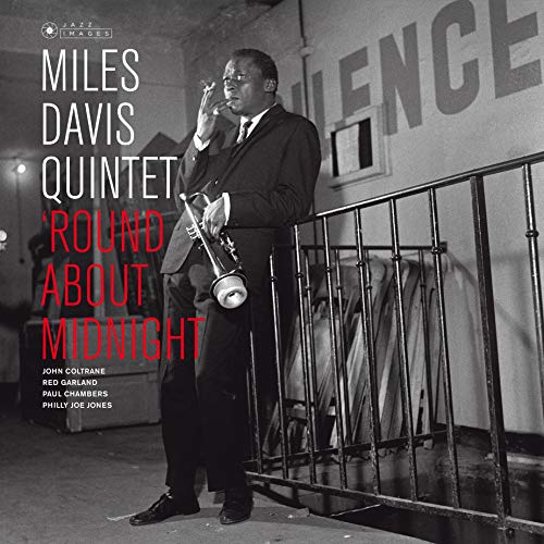 Black and white vinyl album cover featuring Miles Davis holding a trumpet.