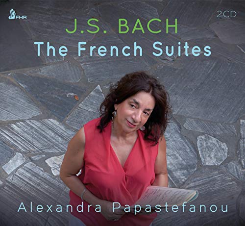 CD cover with a woman in a pink dress holding sheet music, on a stone background.