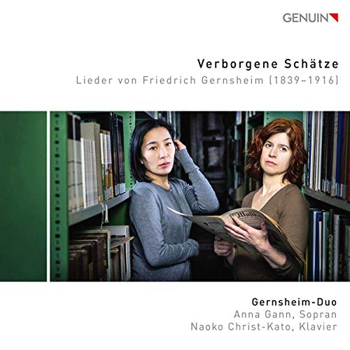 Two women with sheet music stand in a library setting.