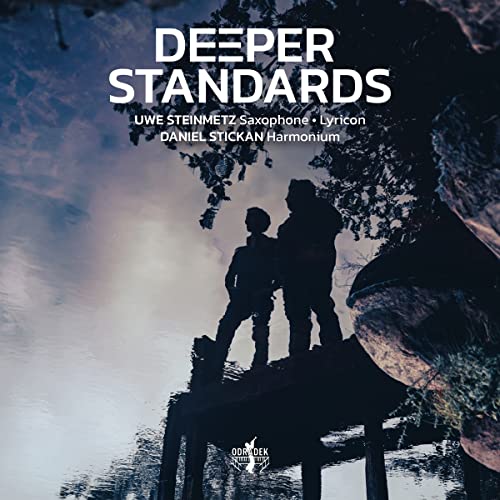 CD cover with silhouetted figures by water, titled “Deeper Standards”.