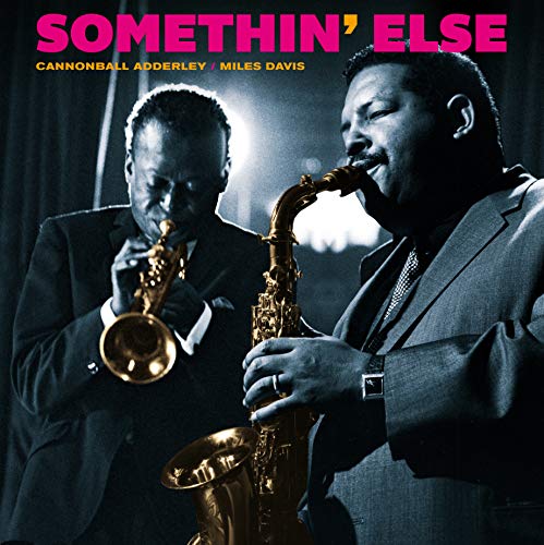 Jazz album cover featuring Cannonball Adderley and Miles Davis with a blue vinyl record.